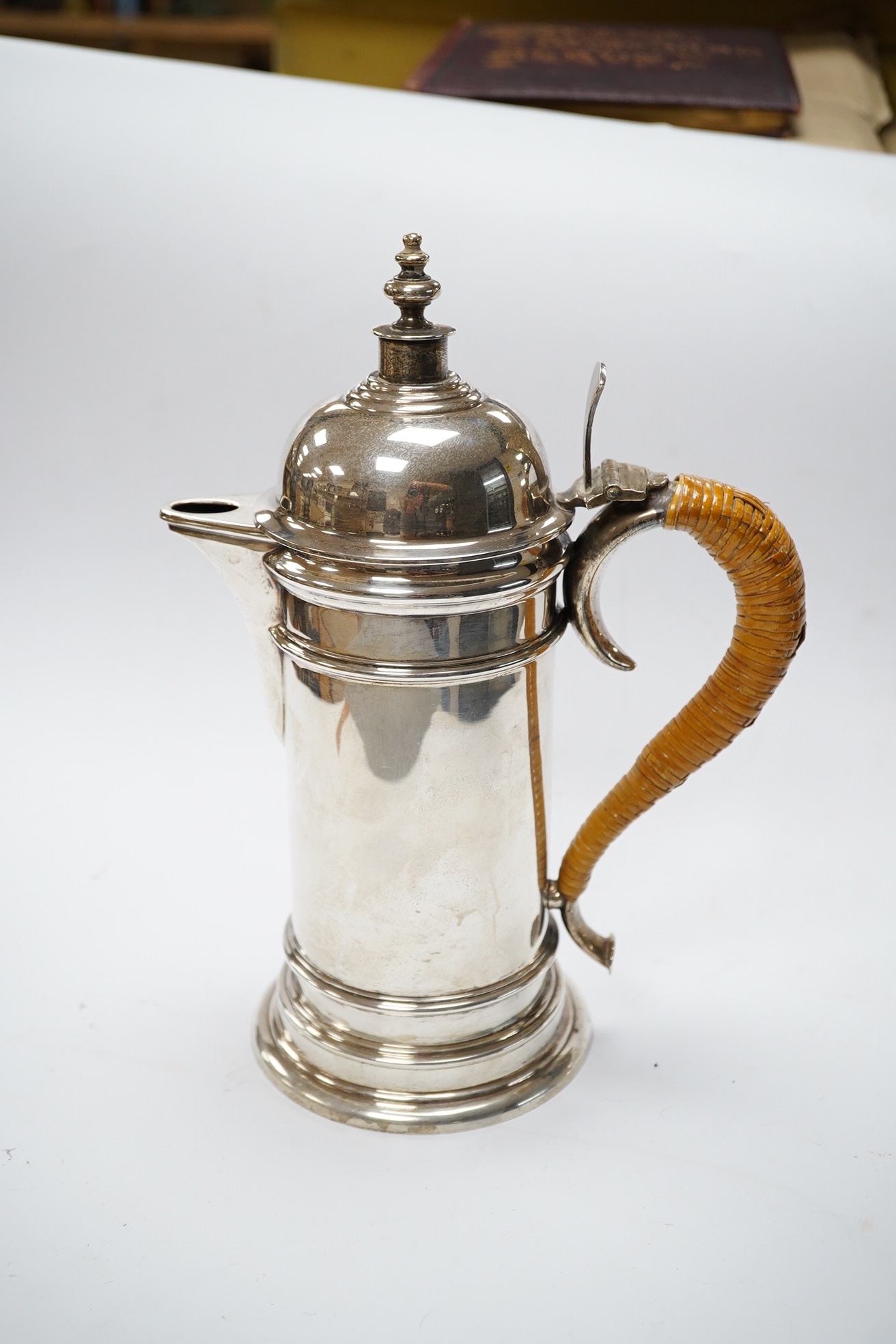 A George V silver cylindrical coffee pot, with a wicker handle, Birmingham, 1917 by Elkington & Co, 25.6cm, gross weight 23.1oz. Condition - fair